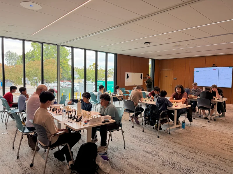 Players competing across the C4 tournament room.