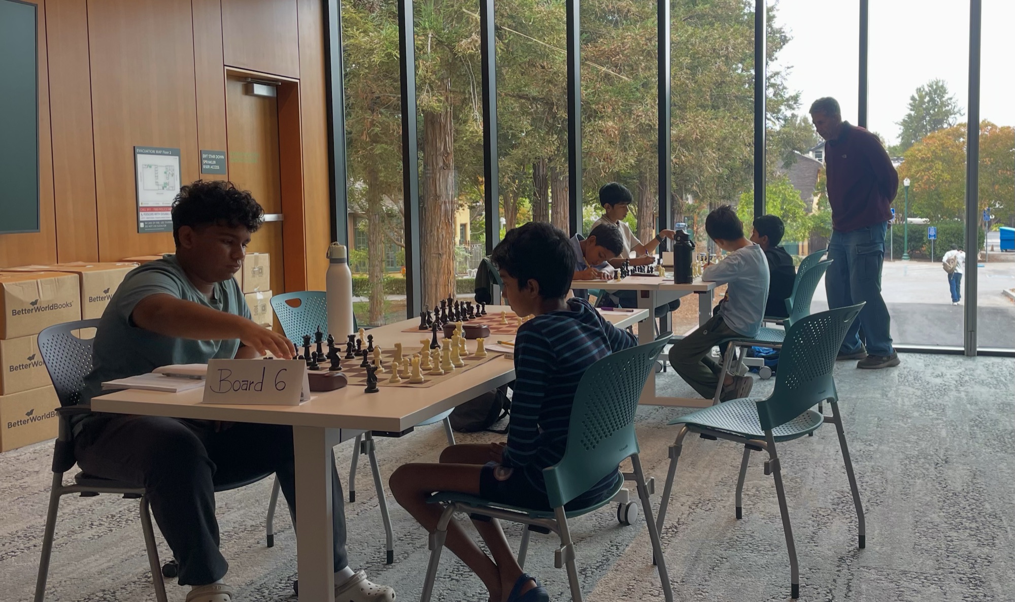 Children playing at a local chess tournament